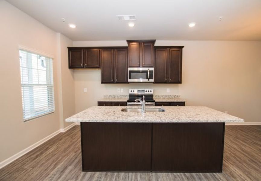 Representative furnished interior of a home built from the Cadence Unit A by Piedmont Residential in Ross Pointe, Kennesaw (Image 4).