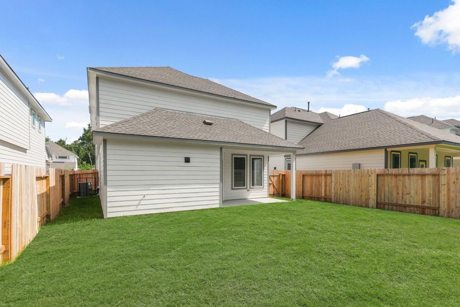 Exterior details and patio area of a home in Cypresswood Landing, Humble (Image 3).