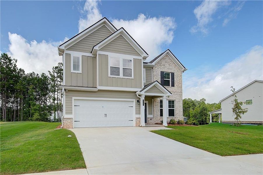 Front exterior of a new home in Westminster, Covington, GA, highlighting curb appeal (Image 1).