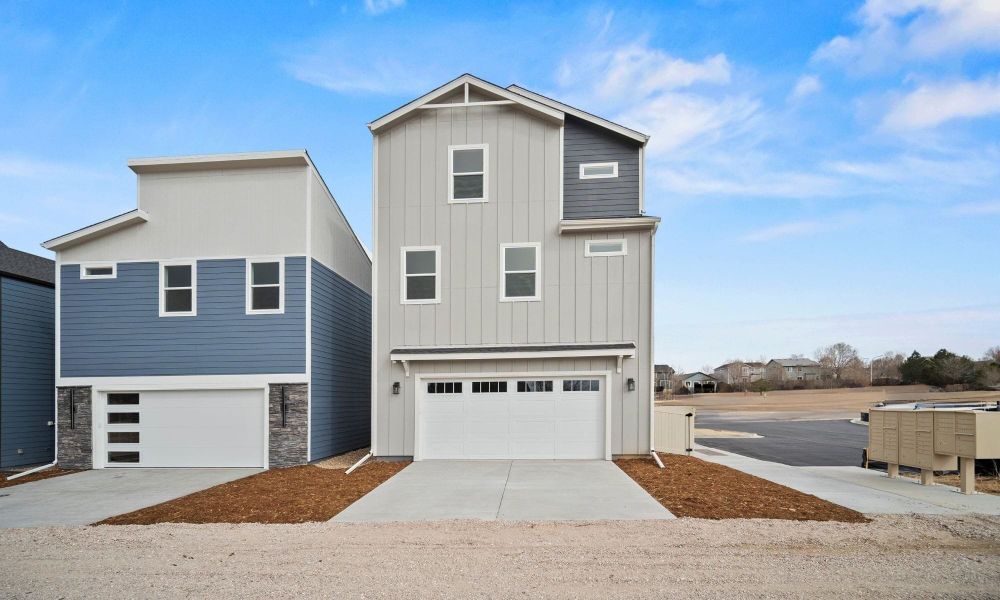 Front exterior of a new home in Pony Park, Colorado Springs, CO, highlighting curb appeal (Image 21). Front exterior of a new home in Pony Park, Colorado Springs, CO, highlighting curb appeal (Image 21).