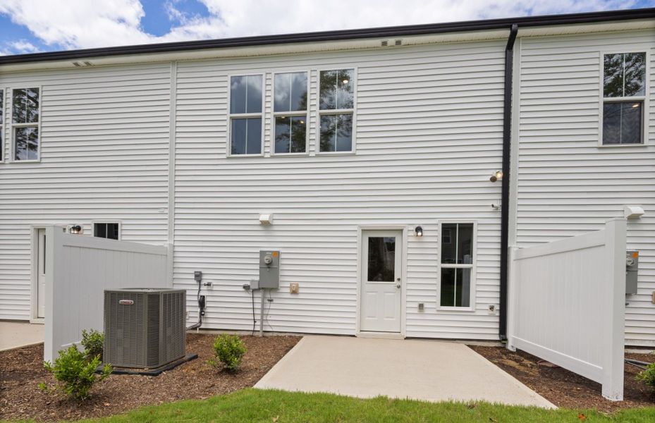 Exterior details and patio area of a home in Poets Walk, Whitsett (Image 3).