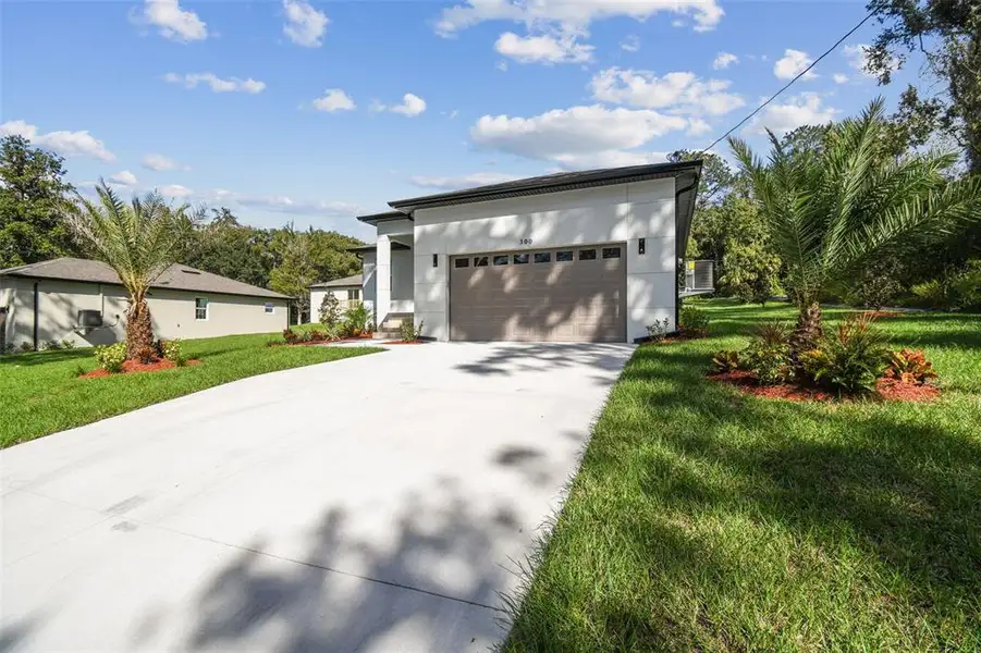 Front exterior of a new home in , Brooksville, FL, highlighting curb appeal (Image 23).