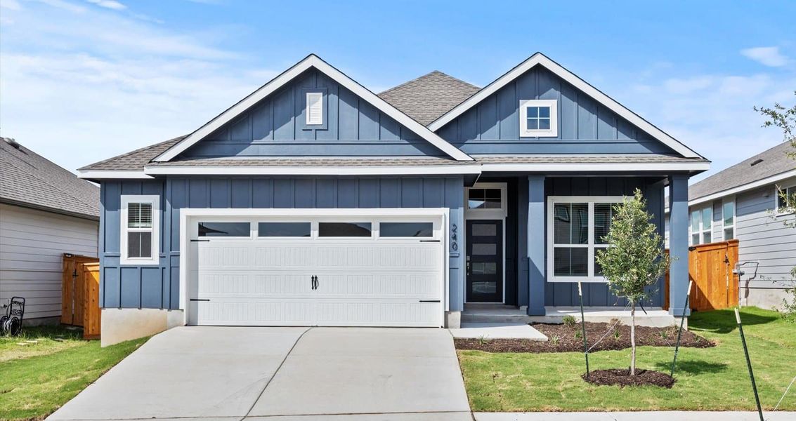 Front exterior of a new home in Trace, San Marcos, TX, highlighting curb appeal (Image 1).