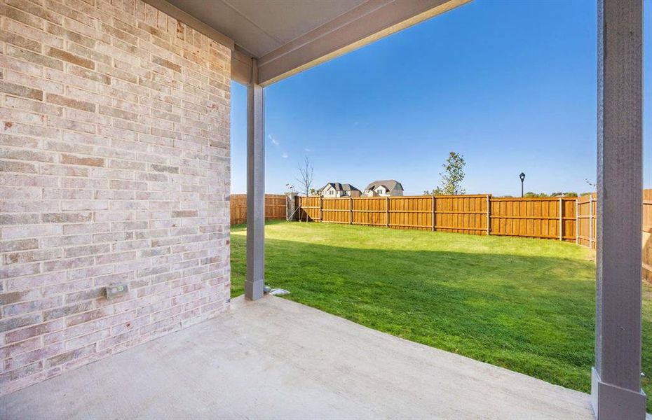 Charming covered patio  *real home pictured