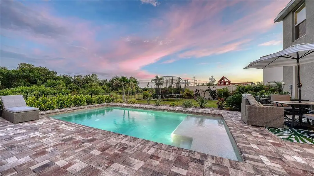 Exterior details and patio area of a home in Bella Lago, Parrish (Image 24).