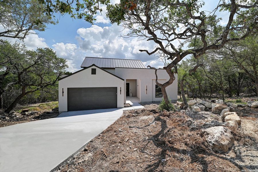 Front exterior of a new home in , Fischer, TX, highlighting curb appeal (Image 24).