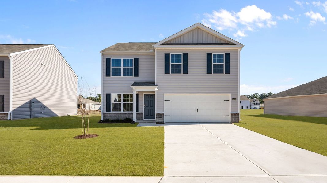 Front exterior of a new home in Madeline Farm, New Bern, NC, highlighting curb appeal (Image 1).