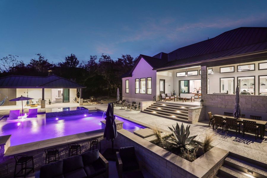 Private Resort: Situated on over one acre, this home offers a private resort experience with peekaboo lake views.