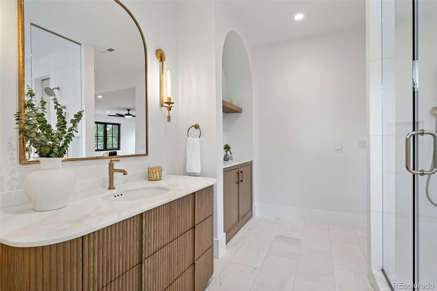 Separate vanities and water closets in the primary bath