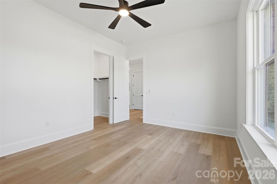 bedroom 2- front bedroom w/ ensuite bath, wood shelves