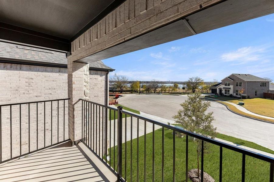 Exterior details and patio area of a home in Valencia on The Lake, Little Elm (Image 22).