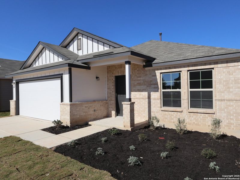 Front exterior of a new home in Winding Brook, San Antonio, TX, highlighting curb appeal (Image 20).