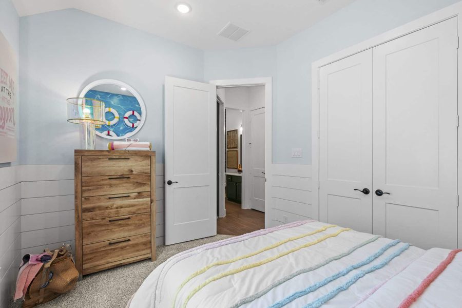 Representative furnished interior of a home built from the Aubrey by Chesmar Homes in Sienna, Missouri City (Image 19).