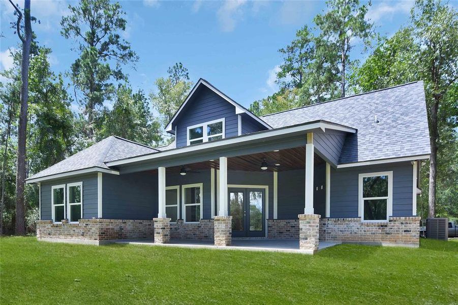 Rear property view - love the exterior color of this home!