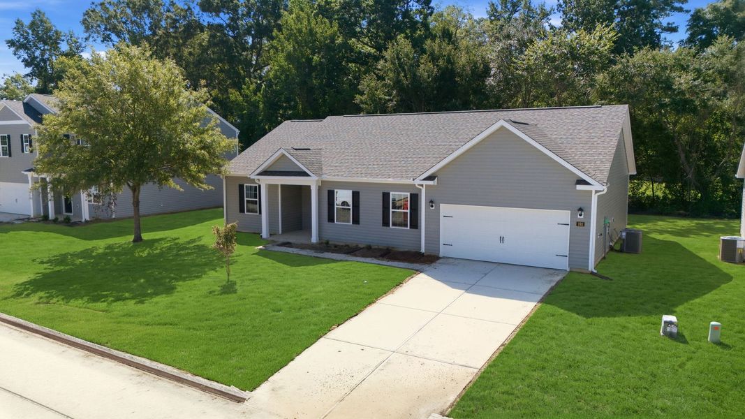 Front exterior of a new home in Tyler - Home on the Lake, New Bern, NC, highlighting curb appeal (Image 22).