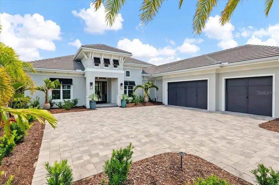 Front exterior of a new home in , Lakewood Ranch, FL, highlighting curb appeal (Image 26). Front exterior of a new home in , Lakewood Ranch, FL, highlighting curb appeal (Image 26).