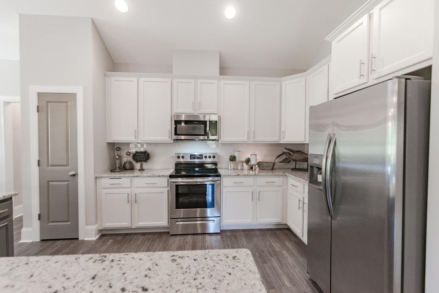 Representative furnished interior of a home built from the Helmsley by Bill Clark Homes in The Sanctuary at Sunset Beach, Sunset Beach (Image 10). Representative furnished interior of a home built from the Helmsley by Bill Clark Homes in The Sanctuary at Sunset Beach, Sunset Beach (Image 10).