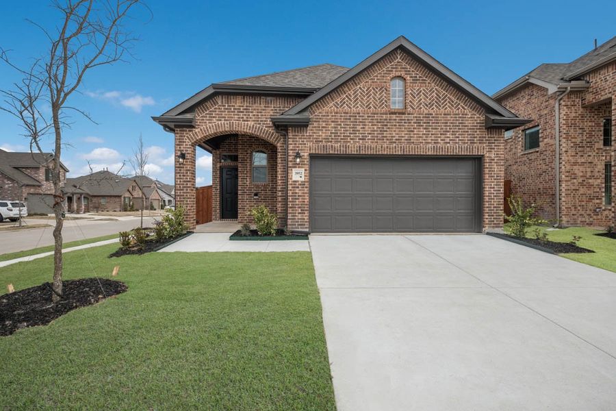 Front exterior of a new home in Jordan Ranch, Fulshear, TX, highlighting curb appeal (Image 25). Front exterior of a new home in Jordan Ranch, Fulshear, TX, highlighting curb appeal (Image 25).