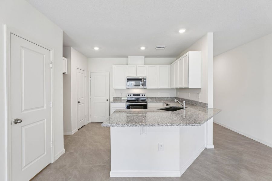 Furnished interior view inside a new home in Reserve at Forest Lake Townhomes, Lake Wales (Image 6).