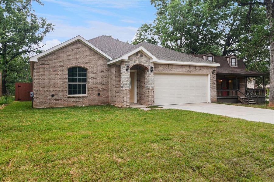 Front exterior of a new home in , Mabank, TX, highlighting curb appeal (Image 2). Front exterior of a new home in , Mabank, TX, highlighting curb appeal (Image 2).