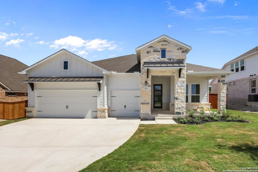Front exterior of a new home in Homestead 65', Schertz, TX, highlighting curb appeal (Image 20).