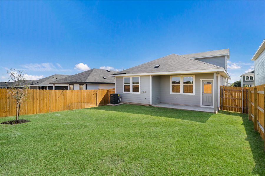 Front exterior of a new home in Marigold, Uhland, TX, highlighting curb appeal (Image 14). Front exterior of a new home in Marigold, Uhland, TX, highlighting curb appeal (Image 14).