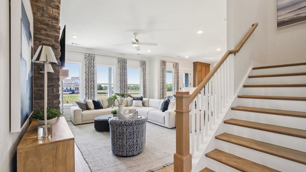 Bright and open concept first floor and staircase with oak treads and painted risers