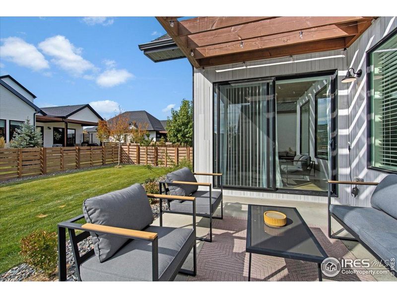 Exterior details and patio area of a home in Pelican Shores at Water Valley, Windsor (Image 3).