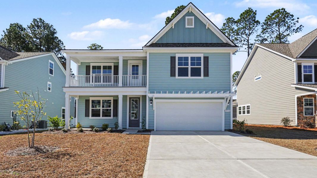 Front exterior of a new home in Heron Pointe, Myrtle Beach, SC, highlighting curb appeal (Image 1). Front exterior of a new home in Heron Pointe, Myrtle Beach, SC, highlighting curb appeal (Image 1).