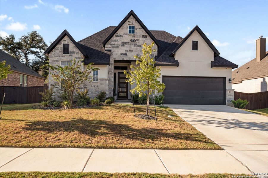 Front exterior of a new home in Mesa Western, Cibolo, TX, highlighting curb appeal (Image 2).