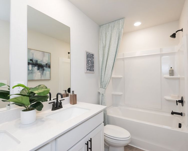 Furnished interior view inside a new home in Vines at Mill Creek - Estate Series, Braselton (Image 19).