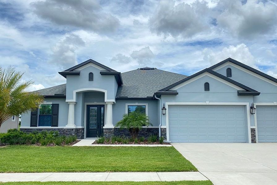 Front exterior of a new home in River Preserve Estates, Parrish, FL, highlighting curb appeal (Image 27).