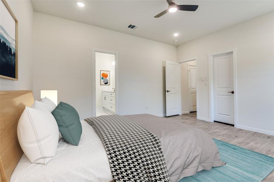Bedroom with recessed lighting, ceiling fan, wood finished floors, and ensuite bathroom
