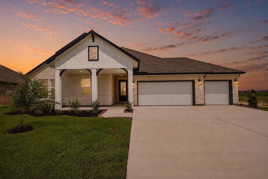 Front exterior of a new home in Grand Oaks, Mont Belvieu, TX, highlighting curb appeal (Image 2). Front exterior of a new home in Grand Oaks, Mont Belvieu, TX, highlighting curb appeal (Image 2).