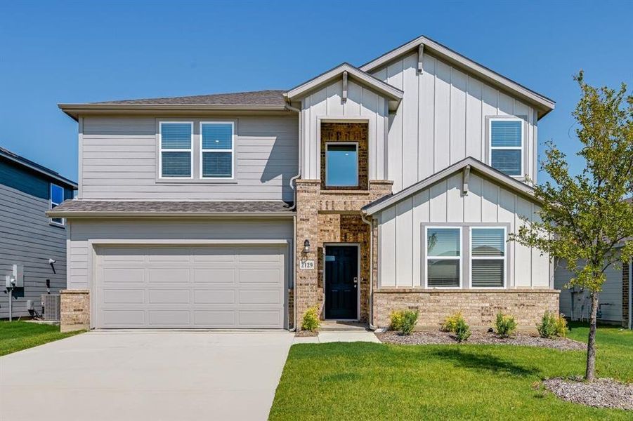 Front exterior of a new home in River Ridge, Crandall, TX, highlighting curb appeal (Image 2). Front exterior of a new home in River Ridge, Crandall, TX, highlighting curb appeal (Image 2).