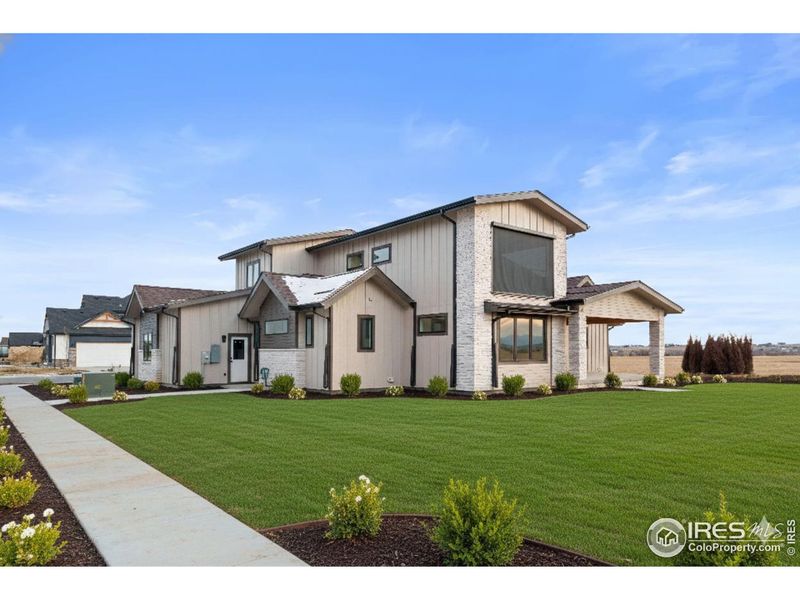 Front exterior of a new home in , Berthoud, CO, highlighting curb appeal (Image 21).