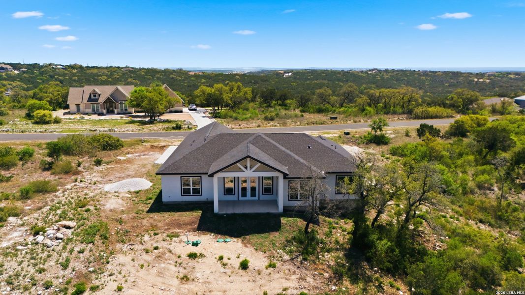 Front exterior of a new home in , Mico, TX, highlighting curb appeal (Image 5).