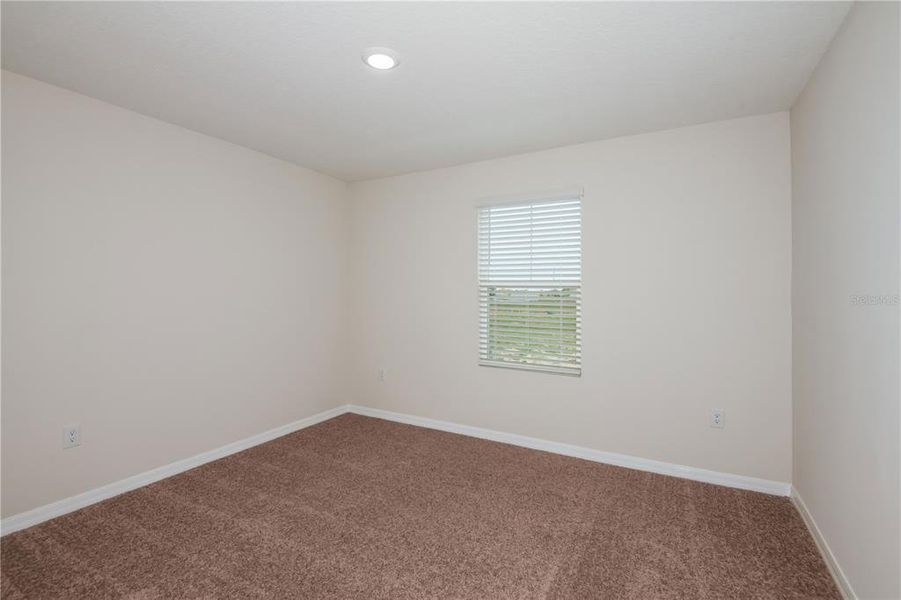 Spacious, unfurnished interior of a new home in Grove at Crosswind, Haines City (Image 17).