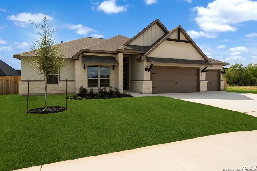 Front exterior of a new home in , Castroville, TX, highlighting curb appeal (Image 1). Front exterior of a new home in , Castroville, TX, highlighting curb appeal (Image 1).