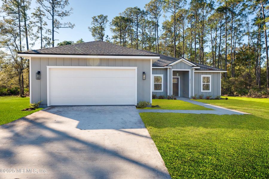 Front exterior of a new home in , Middleburg, FL, highlighting curb appeal (Image 2).