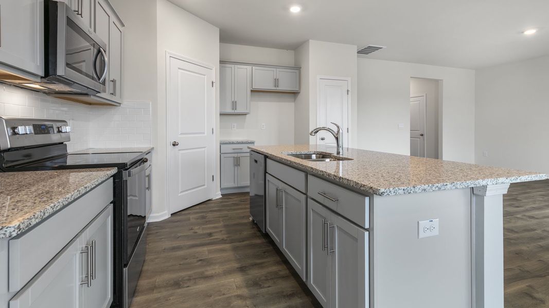Furnished interior view inside a new home in The Grove at Matthews Landing, Fuquay Varina (Image 5).