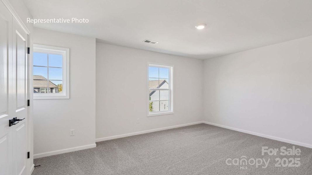 Spacious, unfurnished interior of a new home in Sanctuary at Southgate, Indian Trail (Image 22).