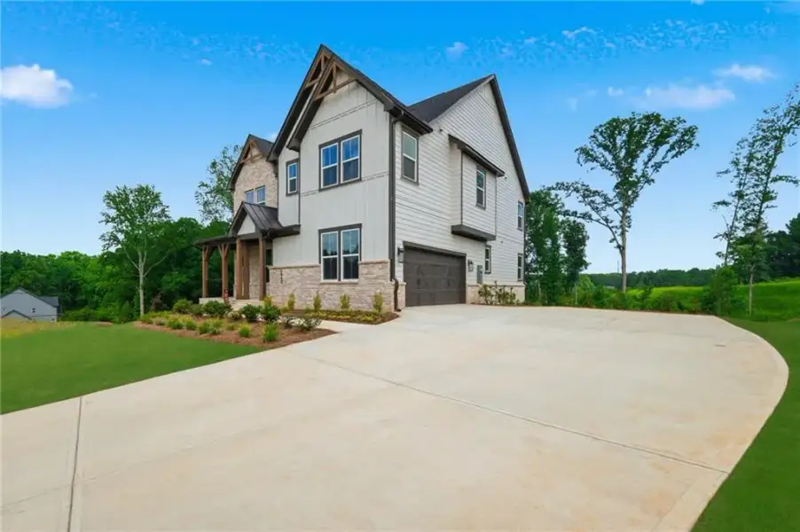 Front exterior of a new home in Acacia, Cumming, GA, highlighting curb appeal (Image 1). Front exterior of a new home in Acacia, Cumming, GA, highlighting curb appeal (Image 1).