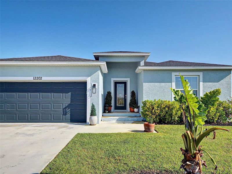 Front exterior of a new home in , Port Charlotte, FL, highlighting curb appeal (Image 23). Front exterior of a new home in , Port Charlotte, FL, highlighting curb appeal (Image 23).