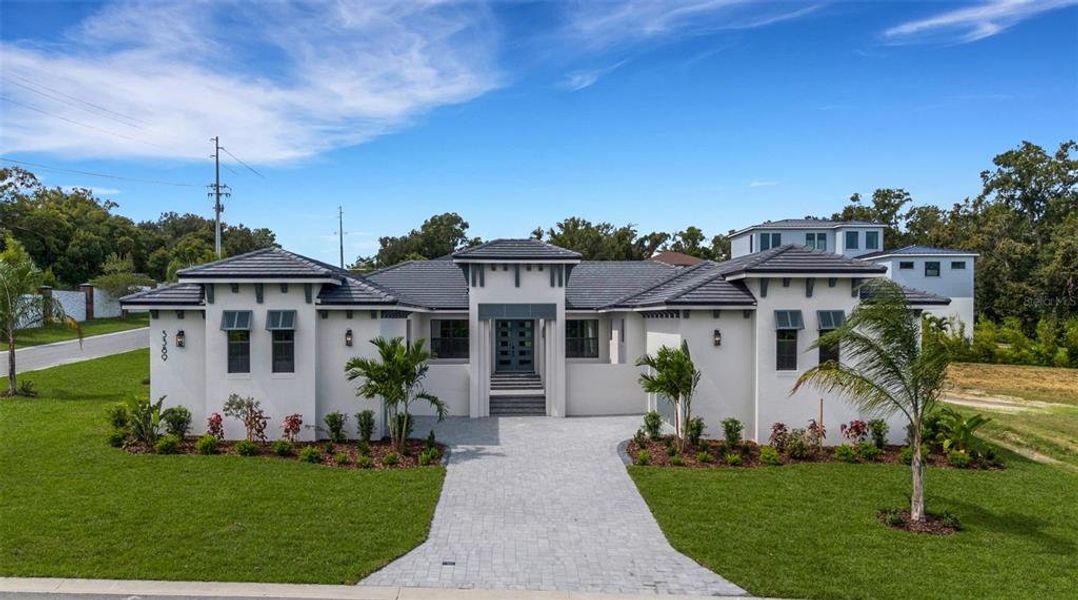 Front exterior of a new home in , Lakeland, FL, highlighting curb appeal (Image 1). Front exterior of a new home in , Lakeland, FL, highlighting curb appeal (Image 1).