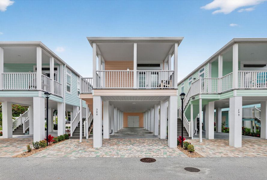 Front exterior of a new home in , Jensen Beach, FL, highlighting curb appeal (Image 22).