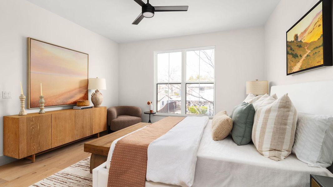 Bedroom with a ceiling fan and wood finished floors