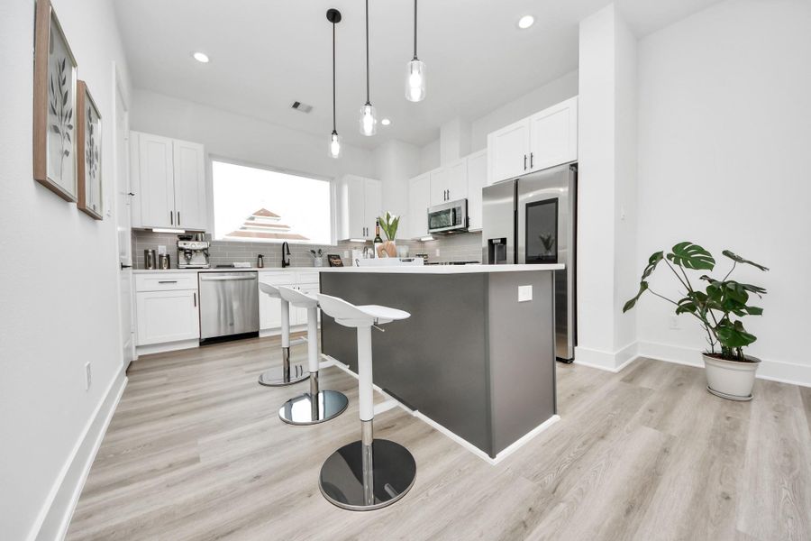 Arrive to the kitchen! Beautiful quartz counter top, extended island, shaker cabinets, stainless steel appliances, walk-in pantry and more! Arrive to the kitchen! Beautiful quartz counter top, extended island, shaker cabinets, stainless steel appliances, walk-in pantry and more!