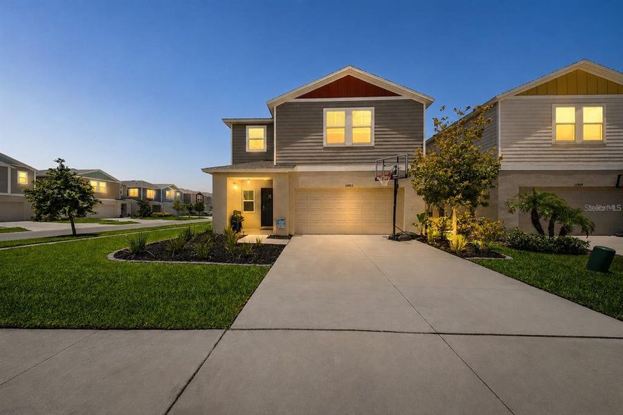 Front exterior of a new home in New Home Communities Near Tampa, Ocala, and Orlando, Florida, Lithia, FL, highlighting curb appeal (Image 1). Front exterior of a new home in New Home Communities Near Tampa, Ocala, and Orlando, Florida, Lithia, FL, highlighting curb appeal (Image 1).