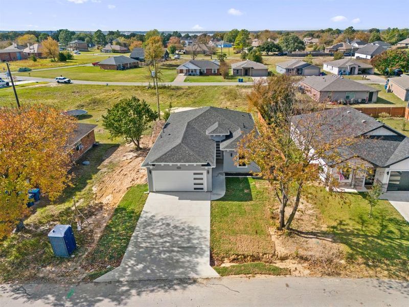 Front exterior of a new home in , Gun Barrel City, TX, highlighting curb appeal (Image 22).
